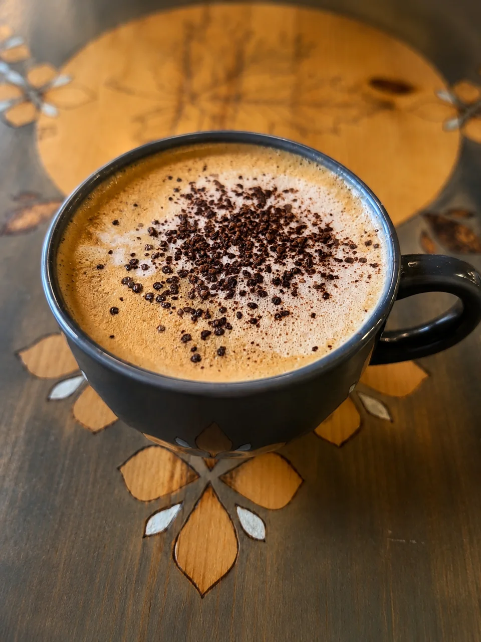 Coffee topped with cocoa served at a Pria