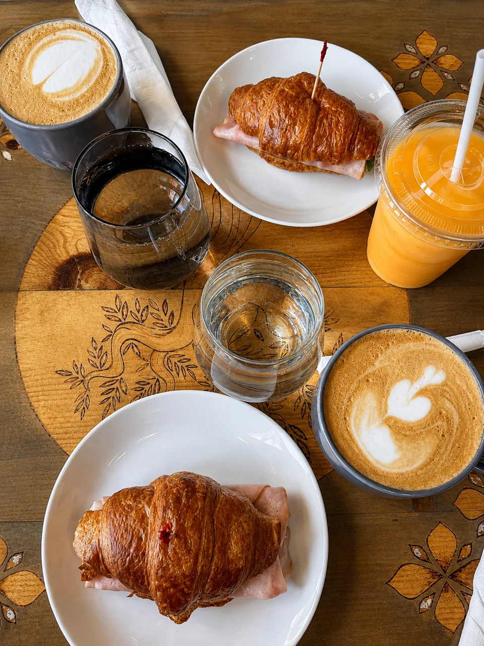 Coffee, croissants and drinks on a table at a Pria